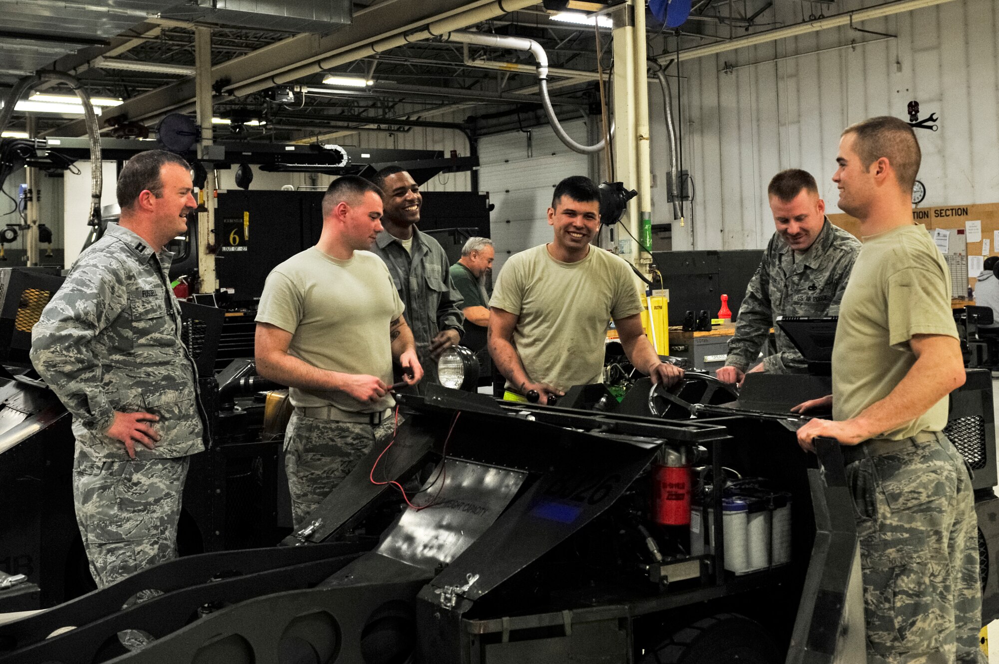 Chaplain (Capt.) Thomas Fussell, 354th Fighter Wing protestant chaplain, visits with members of the 354th Maintenance Squadron aerospace ground equipment shop, March 6, 2014 Eielson Air Force Base, Alaska. Of the many services the chaplains offer to enhance spiritual fitness, one of them is getting out into the units and getting to know the Airmen. (U.S. Air Force photo/Senior Airman Ashley Nicole Taylor/Released)