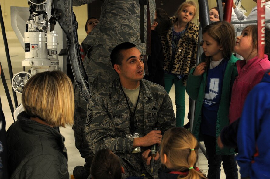Master Sgt. Michael Aponte with the 188th Aircraft Maintenance Squadron speaks with students from Fort Smith Union Christian Academy March 5, 2014, as part of the unit’s community outreach and base tour program. Students in grades 1st-4th toured the 188th’s hangar, Fire Emergency Services Office and Security Forces Squadron during their visit. (U.S. Air National Guard photo by Tech. Sgt. Josh Lewis/released)