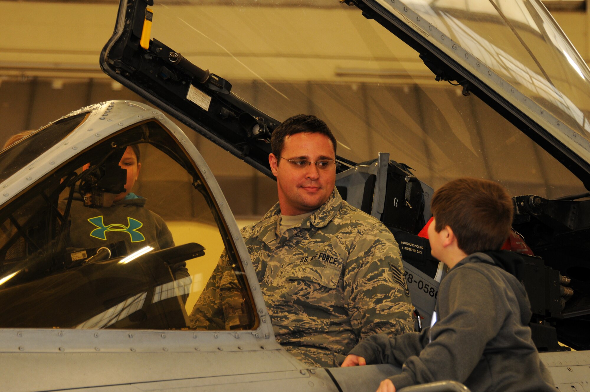 Tech Sgt. Shawn Thorne with the 188th Aircraft Maintenance Squadron speaks with students from Fort Smith Union Christian Academy March 5, 2014, as part of the unit’s community outreach and base tour program. Students in grades 1st-4th toured the 188th’s hangar, Fire Emergency Services Office and Security Forces Squadron during their visit. (U.S. Air National Guard photo by Tech. Sgt. Josh Lewis/released)