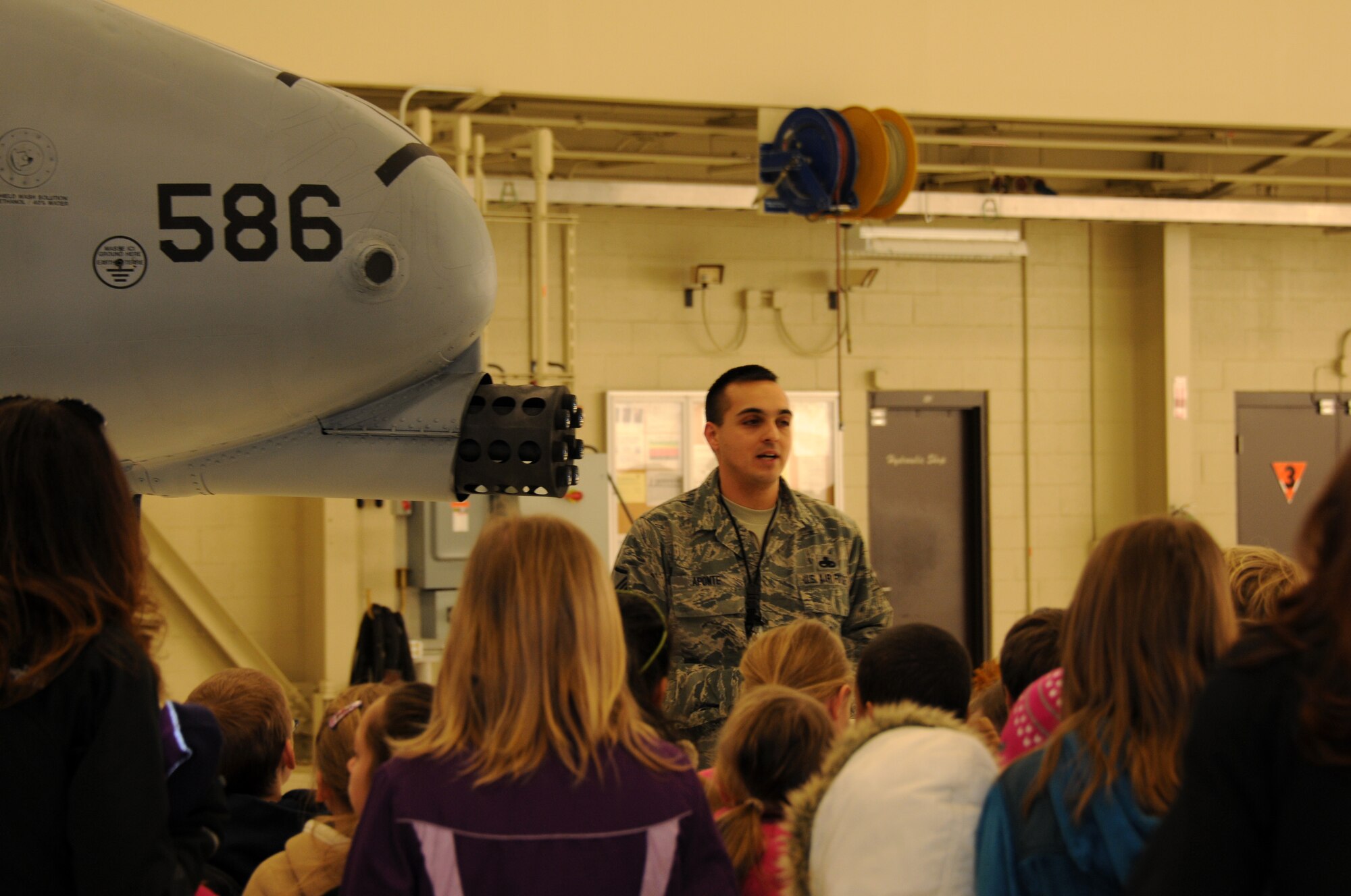 Master Sgt. Michael Aponte with the 188th Aircraft Maintenance Squadron speaks with students from Fort Smith Union Christian Academy March 5, 2014, as part of the unit’s community outreach and base tour program. Students in grades 1st-4th toured the 188th’s hangar, Fire Emergency Services Office and Security Forces Squadron during their visit. (U.S. Air National Guard photo by Tech. Sgt. Josh Lewis/released)