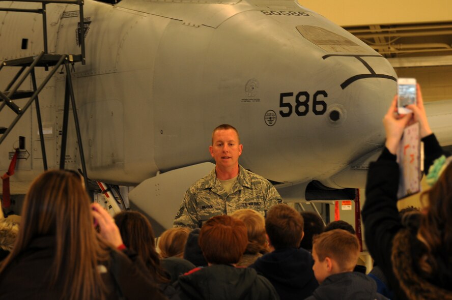 Tech Sgt. Leon Warrick with the 188th Aircraft Maintenance Squadron speaks with students from Fort Smith Union Christian Academy March 5, 2014, as part of the unit’s community outreach and base tour program. Students in grades 1st-4th toured the 188th’s hangar, Fire Emergency Services Office and Security Forces Squadron during their visit. (U.S. Air National Guard photo by Tech. Sgt. Josh Lewis/released)