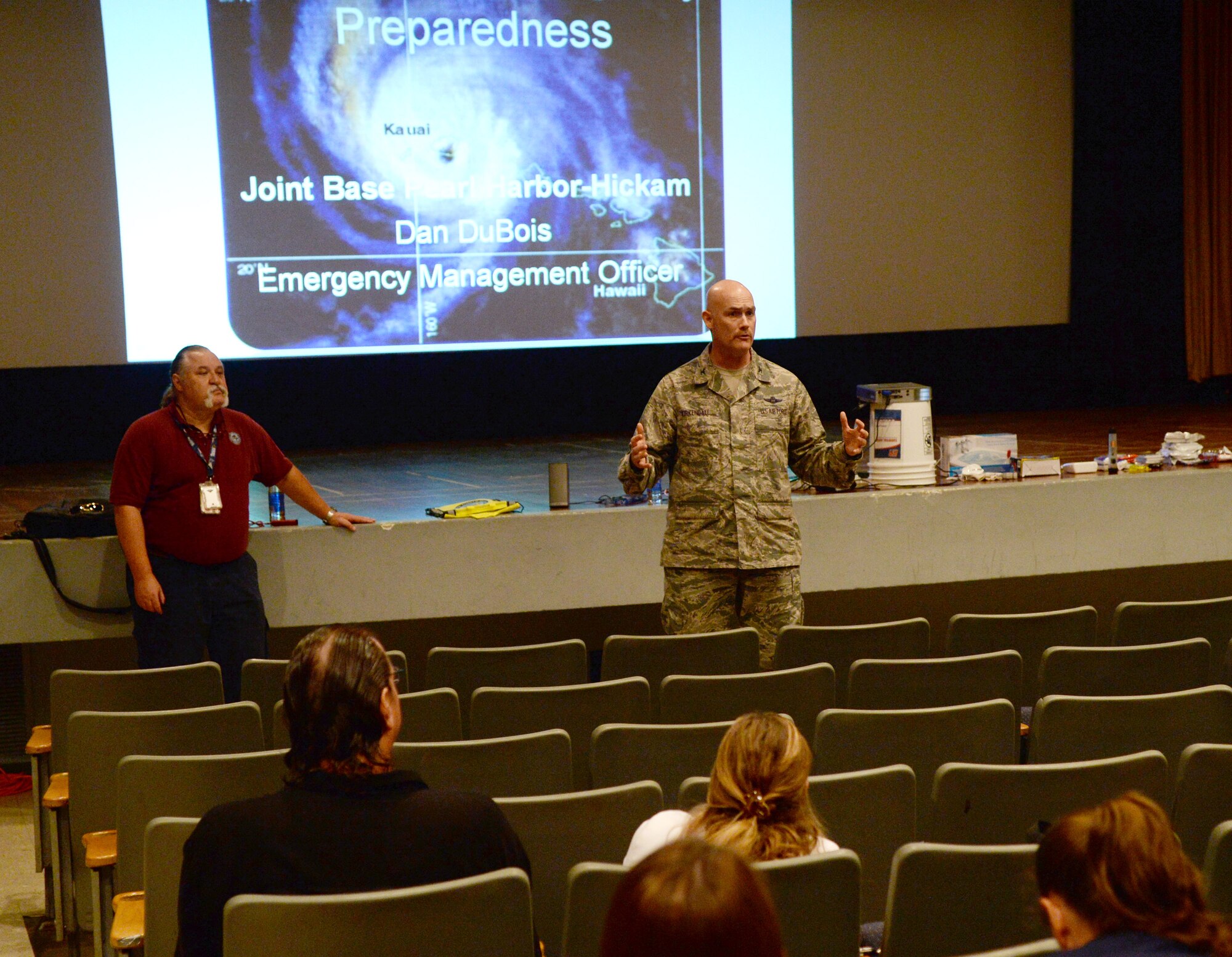 Col. David Kirkendall, 647th Air Base Group commander, speaks with attendees of the Joint Base Pearl Harbor-Hickam Ombudsman Key Spouse Community Preparedness Training at the Hickam Memorial Theater, JBPH-H, Hawaii, March 12, 2014. The training, conducted by Daniel DuBois, JBPH-H emergency management officer, covered response strategies and scenarios regarding possible disasters that could strike the base. (U.S. Air Force photo/Staff Sgt. Alexander Martinez)