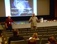 Col. David Kirkendall, 647th Air Base Group commander, speaks with attendees of the Joint Base Pearl Harbor-Hickam Ombudsman Key Spouse Community Preparedness Training at the Hickam Memorial Theater, JBPH-H, Hawaii, March 12, 2014. The training, conducted by Daniel DuBois, JBPH-H emergency management officer, covered response strategies and scenarios regarding possible disasters that could strike the base. (U.S. Air Force photo/Staff Sgt. Alexander Martinez)