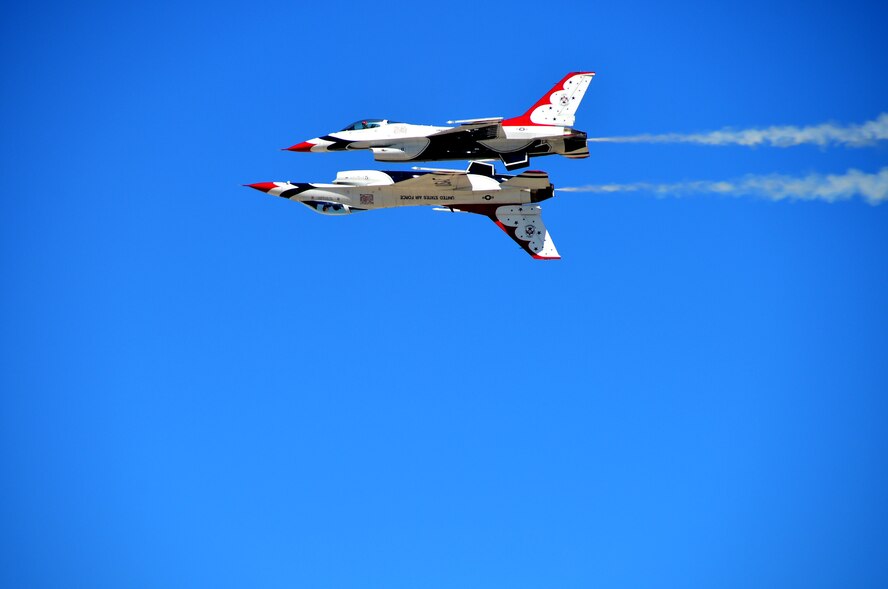 The U.S. Air Force Thunderbirds perform the Calypso for the crowds of Indian Springs Appreciation Day at Creech Air Force Base, Nev., March 11, 2014. This annual event is used to showcase the base and its Airmen to help build relationships with the Indian Springs populace. (U.S. Air Force photo by Staff Sgt. N.B./Released)