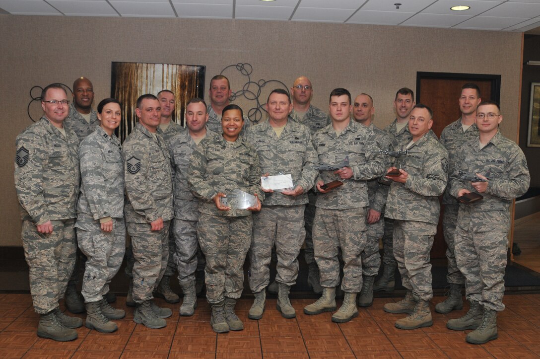 Airmen Of the Year and airmen Of the Quarter pose for a group photo after an award ceremony, March 2, 2014 at the Community Activity Center here. The ceremony rezognized award winners on their oustanding service during 2013. (U.S. Air Force photo by Senior Airman Rachel Kocin)