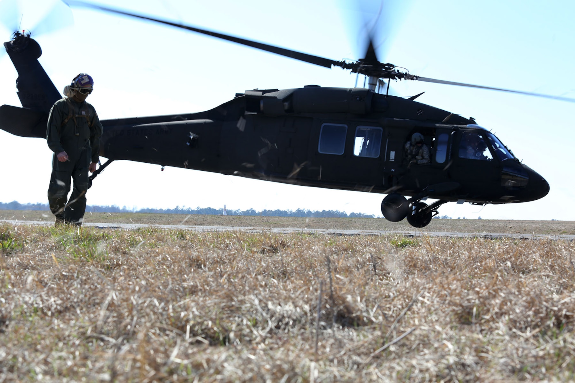A UH-60 Black Hawk takes of from McEntire Joint National Guard Base after being refueled by Marines with Marine Wing Support squadron 273, Feb. 27. The exercise gave the soldiers at McEntire the opportunity to learn Marine Corps hand and arm signals while Marines got familiar with aircraft such as the Black Hawk.