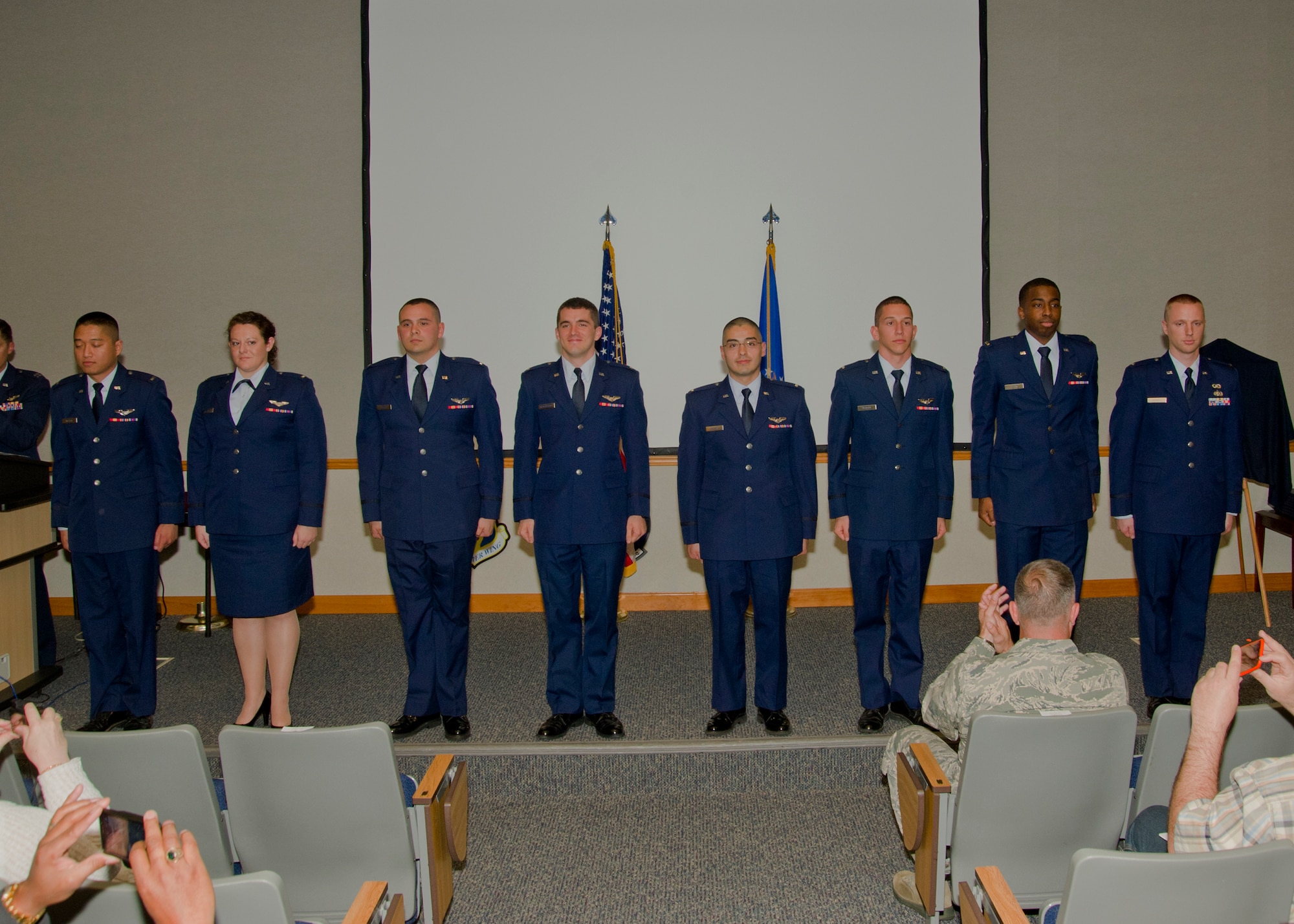 Eight Team Tyndall Airmen stand at attention during their Air Battle Manager Class 14008 graduation ceremony March 12. (U.S. Air Force photo by Airman 1st Class Dustin Mullen)