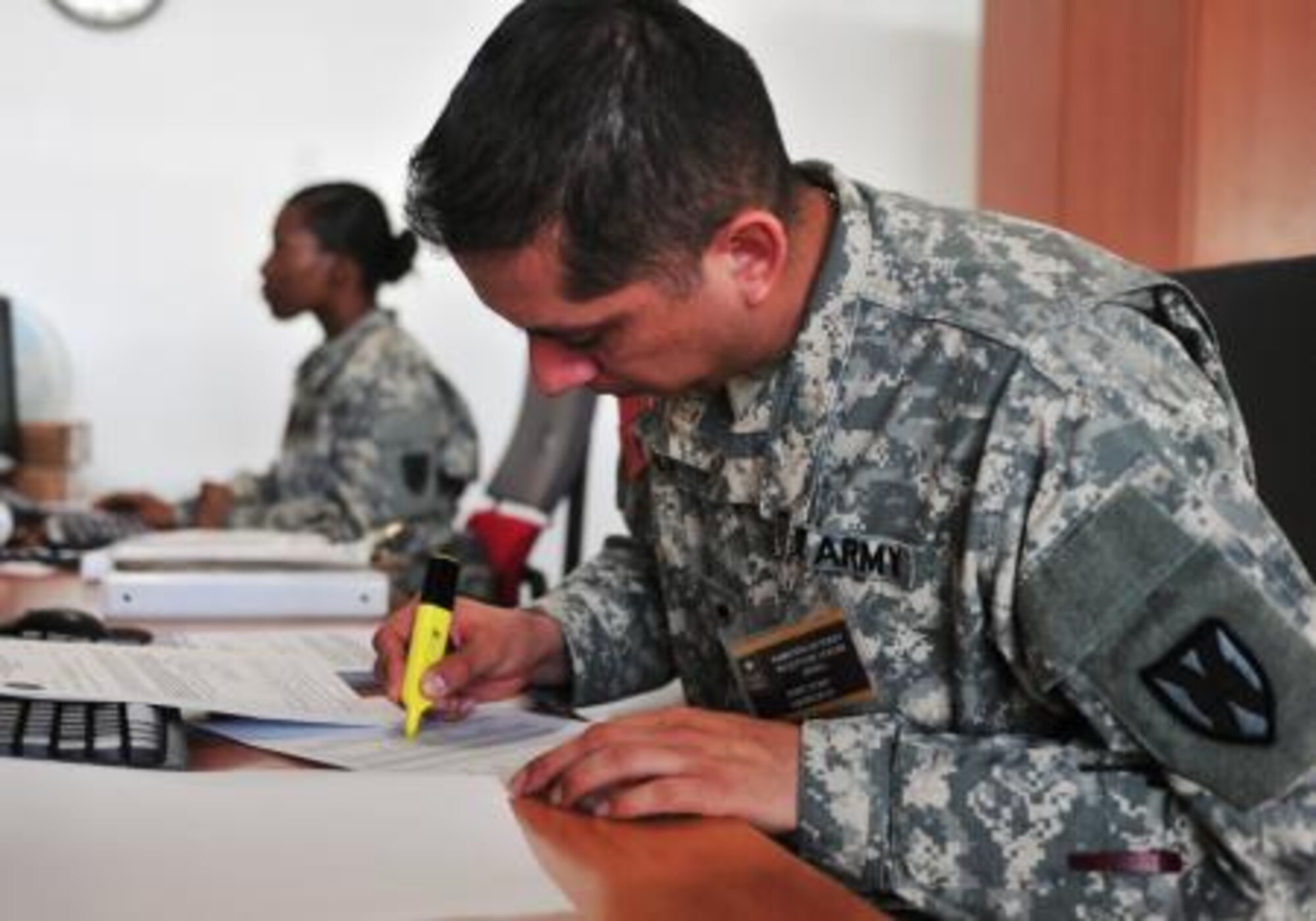 Spc. Cesor D. Silva, a human resources soldier assigned to the 21st Theater Sustainment Command’s 1st Human Resources Sustainment Center and a native of West Chicago, Ill., highlights the names of passengers already processed by the U.S. Army Europe Ramstein Gateway Reception Center at the passenger terminal on Ramstein Air Base, Germany March 11, 2014. The 1st HRSC has five soldiers managing the U.S. Army Europe Ramstein Gateway Reception Center, which is responsible for processing soldiers into Europe and getting them to their assigned units.