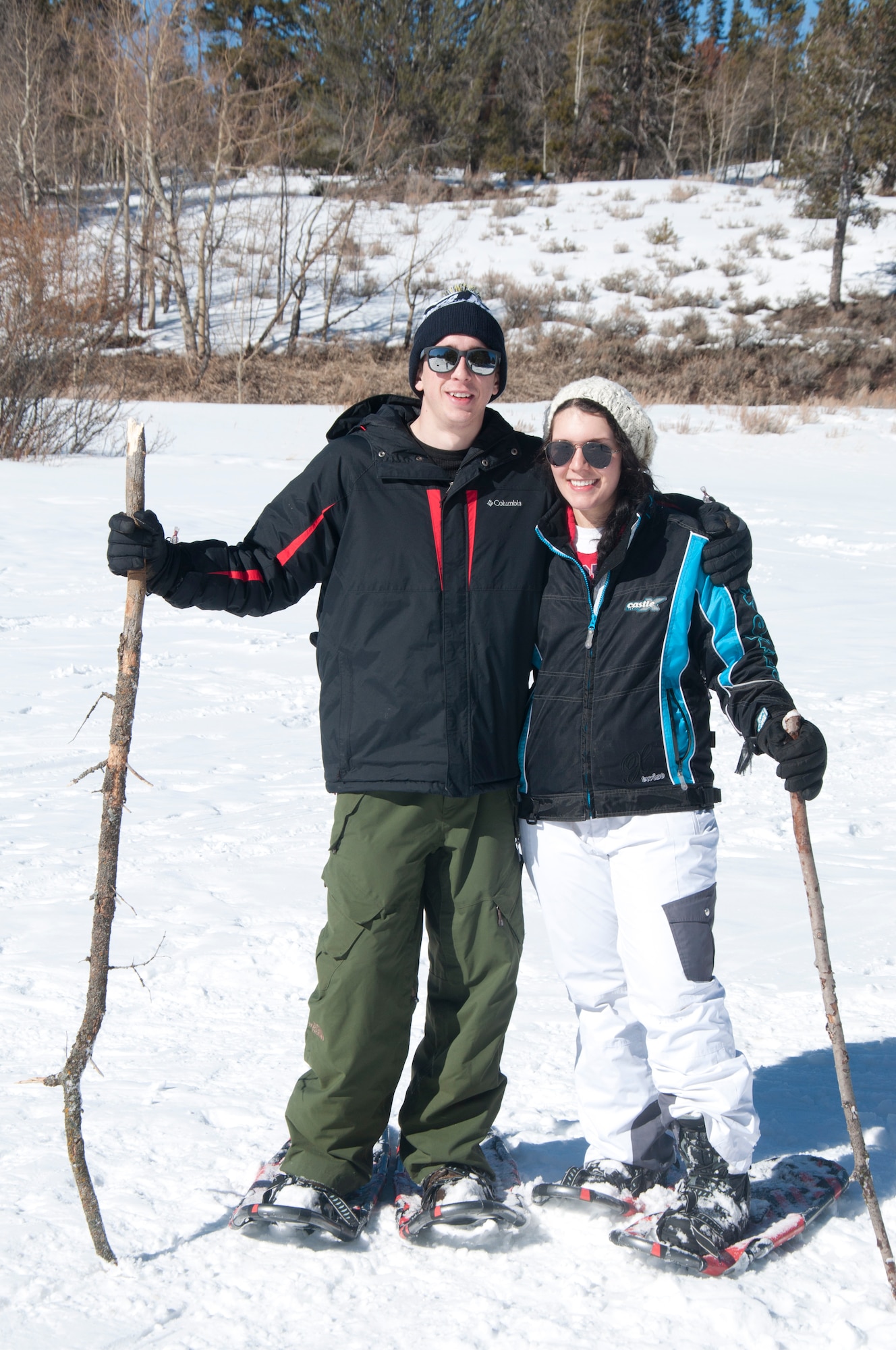 140308-F-GZ967-086 Senior Airman Ryan Ackerman, 90th Missile Maintenance Squadron, and Airman 1st Class Chelsey Mengel, 90th Medical Operations Squadron, pose March 8 after taking a snow-shoe hike during an Outdoor Recreation trip. Although the trip was a snow tuning adventure, Outdoor Rec. offered a variety of activities for everyone to enjoy. (U.S. Air Force photo by Airman 1st Class Brandon Valle)