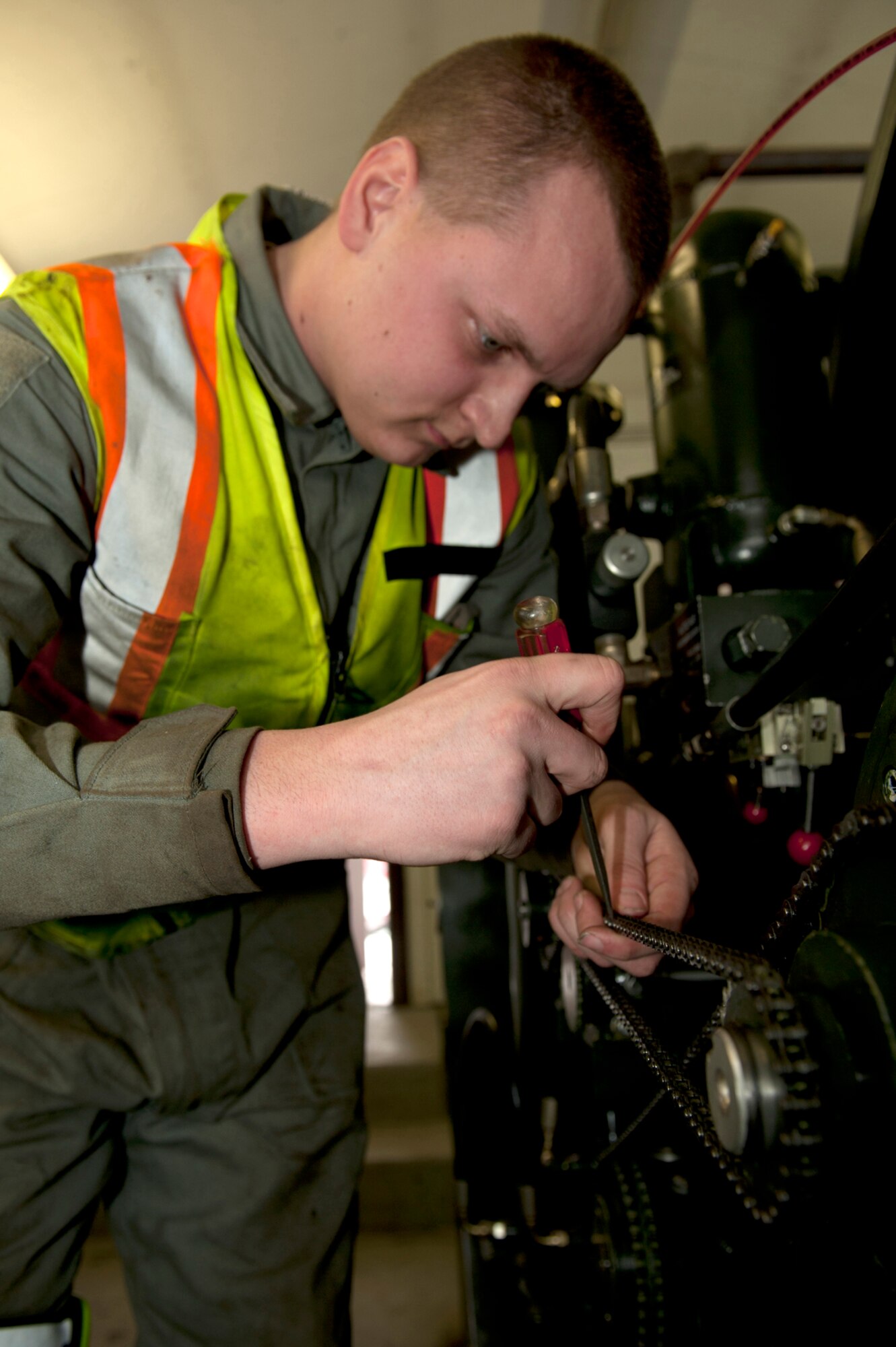 Airman 1st Class Shawn Chilcutt, 773d Civil Engineer Squadron power production barrier maintainer, conducts routine barrier maintenance on Joint Base Elmendorf-Richardson, March 5. The barriers are used to help aircraft land safely and smoothly if a pilot is unable to slow the aircraft safely on the runway.  Chilcutt is a native of Eaton Rapids, Mich. (U.S. Air Force photo/Airman 1st Class Tammie Ramsouer)