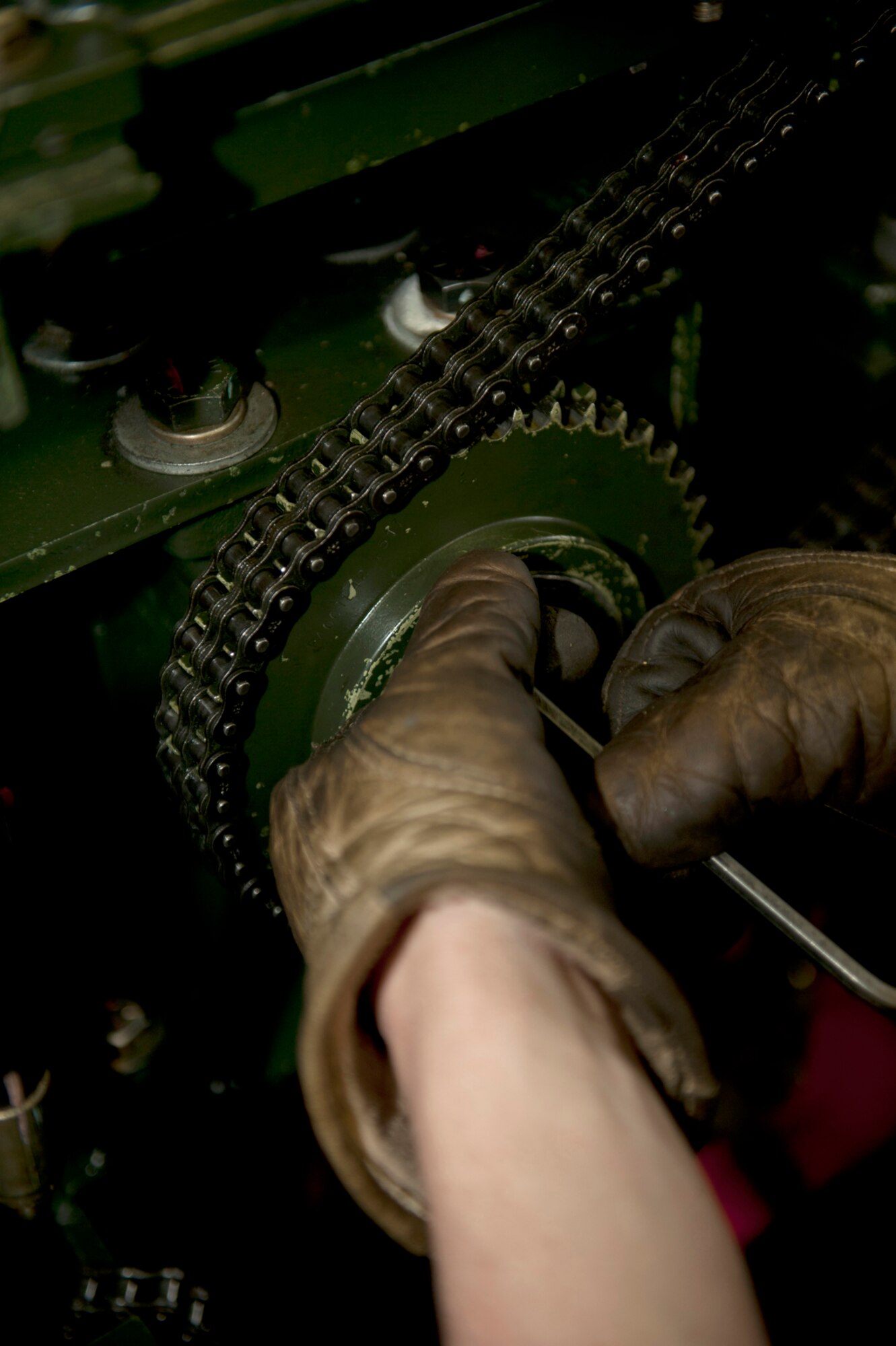 Airman 1st Class Taylor McClellen, 773d Civil Engineer Squadron power production maintainer, conducts routine maintenance on a Barrier Arresting Kit-12 on Joint Base Elmendorf-Richardson, March 5. Barriers are used on a flight line for landing emergencies to slow an aircraft when needed. McClellen is a native of Chehalis, Wash. (U.S. Air Force photo/Airman 1st Class Tammie Ramsouer)