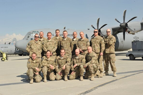 Airmen from the 109th Airlift Wing, New York Air National Guard, pose for a team photo in front of a C-130J Super Hercules at Bagram Airfield, Afghanistan, Feb. 28, 2014. The team was deployed from their home base in Scotia, N.Y.(U.S. Air Force photo by Senior Master Sgt. Gary J. Rihn/Released)
