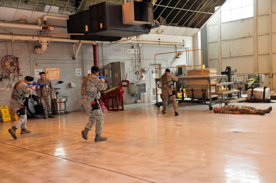 Security Forces Squadron airmen from the 134th Air Refueling Wing take the "suspect", Senior Airman Louis Mayor, into custody during a mock active shooter exercise on March 10 at McGhee Tyson Air National Guard Base, Tennessee.  The exercise included all personnel on base to better train them on what to do in an actual active shooter event.  (U.S. Air National Guard photo by Master Sgt. Kendra M. Owenby, 134 ARW Public Affairs)