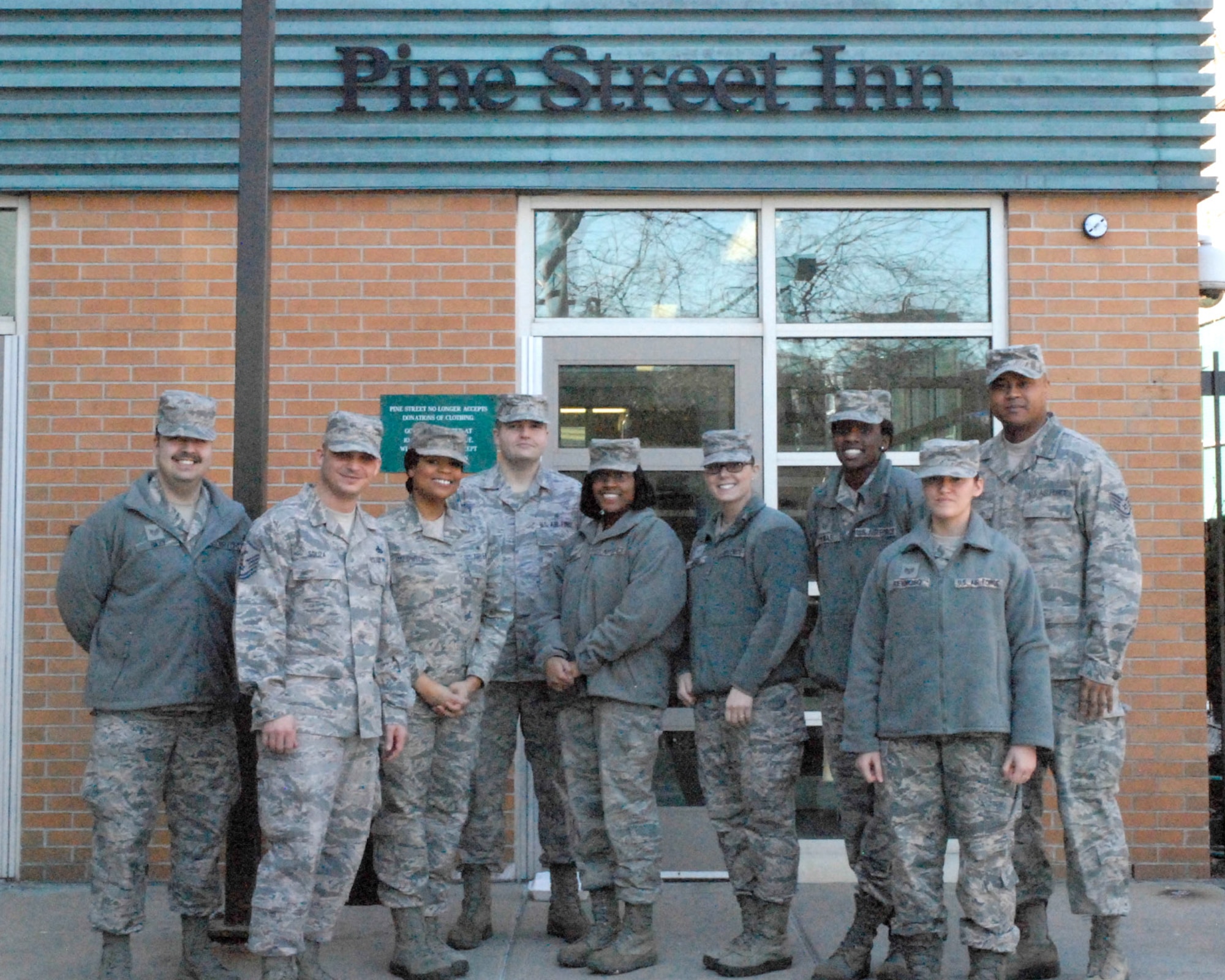 BOSTON – Members of the 66th Medical Squadron pose for a group photo outside the Pine Street Inn after cooking and feeding more than 200 homeless men and women from around Boston. The Pine Street Inn offer alternatives to homeless men and women through a comprehensive range of programs and services. (Courtesy photo)