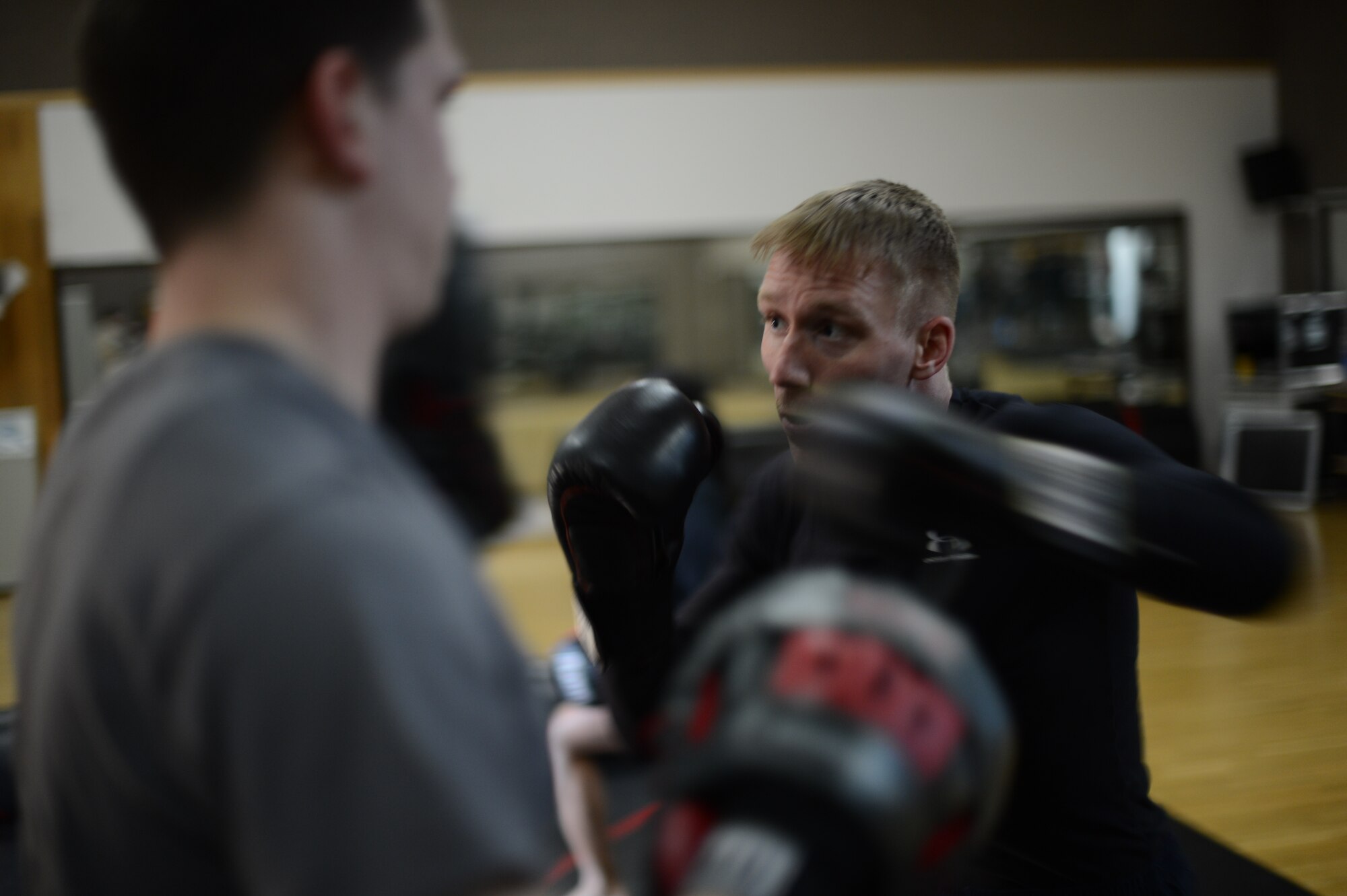 U.S. Air Force Senior Airman Sean Whitaker, a Spangdahlem mixed martial arts member from Pittsburgh, practices striking techniques inside the Skelton Memorial Fitness Center at Spangdahlem Air Base, Germany, March 11, 2014. Whitaker attends MMA and grappling training three days a week to stay competent with fighting skills. (U.S. Air Force photo by Senior Airman Gustavo Castillo/Released)  