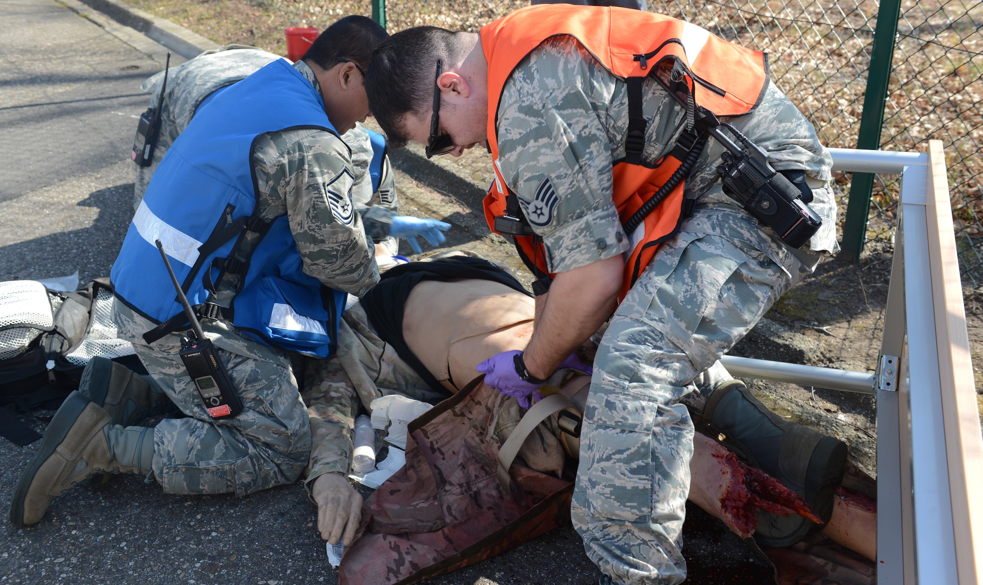 RAMSTEIN AIR BASE, Germany -- Three Airmen from the 86th Medical Group perform first aid on a human simulator during a mass casualty exercise here March 13. The simulators provide realistic training so Airmen can practice a variety of medical responses. The simulators were also featured during the 29th Annual Aerospace Medicine Summit and NATO Science and Technology Organization Technical Course here March 10.  (U.S. Air Force Photo by Tech. Sgt. James M. Hodgman)