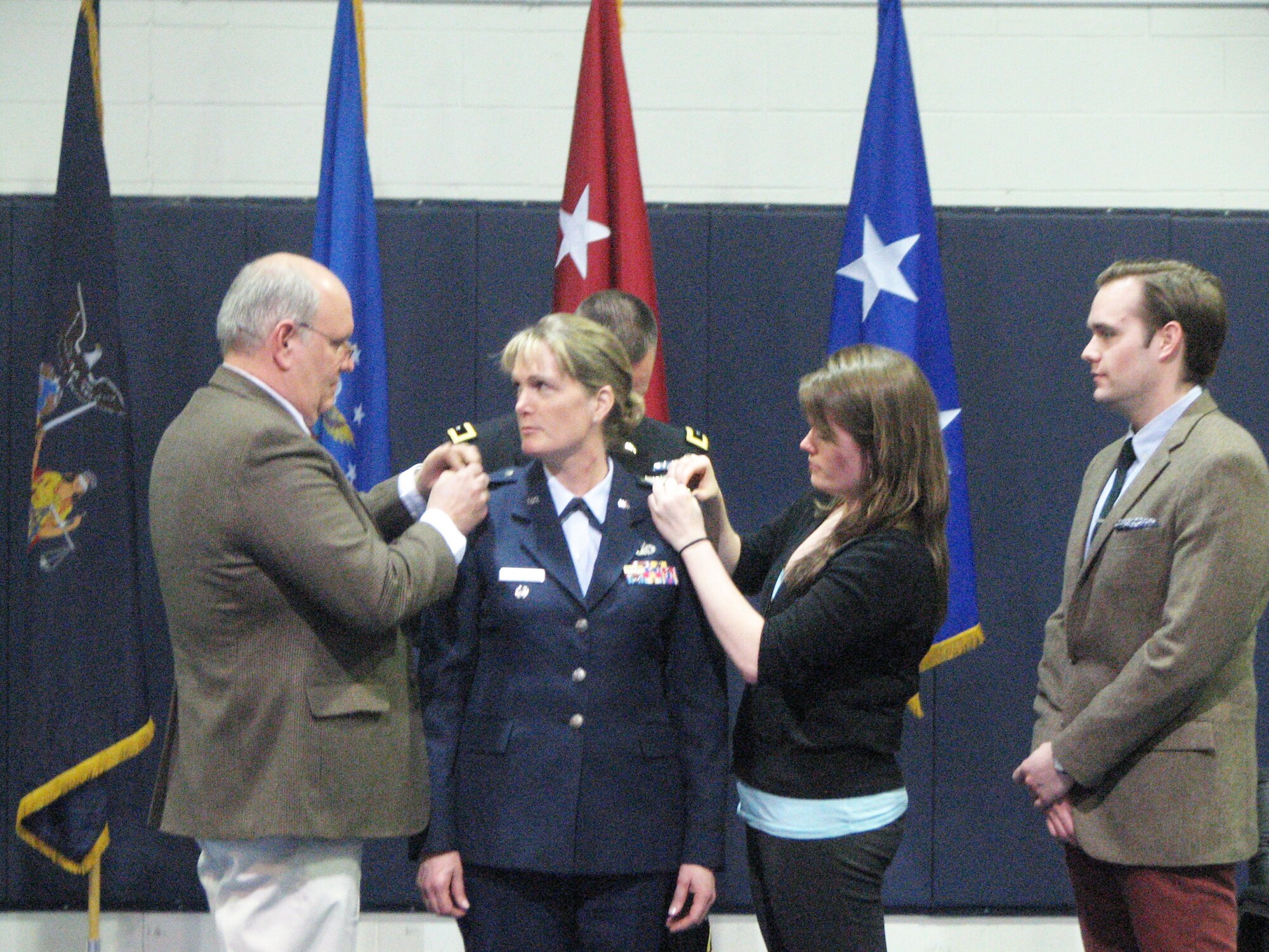 Former EADS Commander Brig. Gen. Dawne Deskins has her new rank 
pinned on during the March 8  promotion ceremony. Her husband, Tony Deskins, 
pins her right shoulder and daughter Brittany places one star on the left 
shoulder, while son Derek looks on. Deskins is now serving as the Special 
Assistant, Sexual Assault and Prevention, to the Director, Air National Guard.
