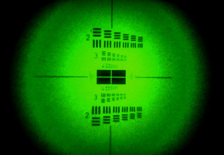 Airmen from the 38th Rescue Squadron aircrew flight equipment flight test PVS 18 Binoculars at Moody Air Force Base, Ga., March 10, 2014. The test focused on the lines and numbers while running though multiple steps to check the binoculars for damage. (U.S. Air Force photo by Airman 1st Class Alexis Millican/Released)