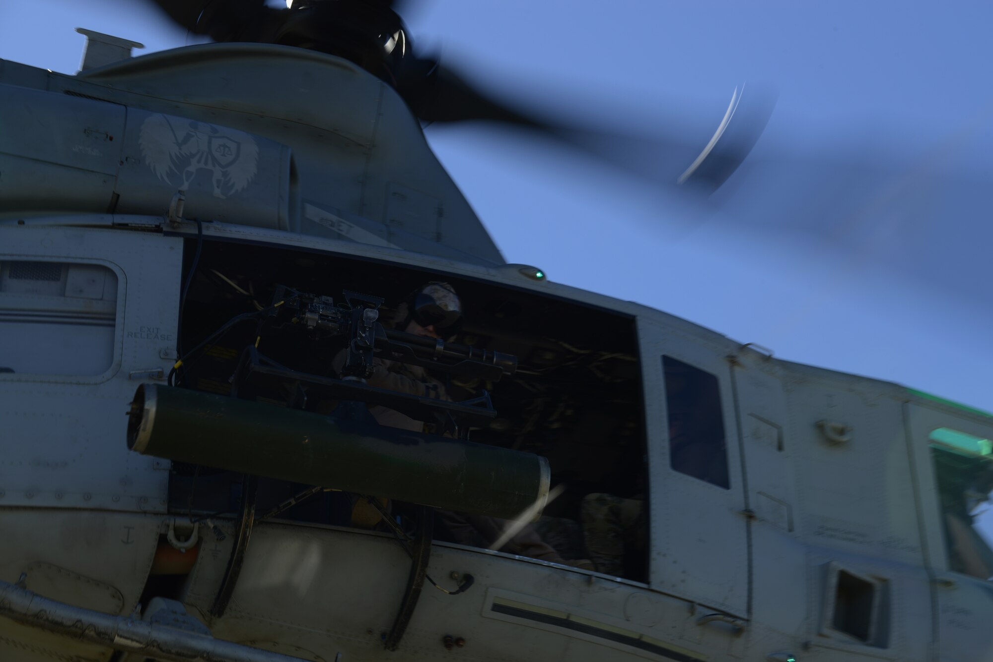 A U.S. Marine Corps UH-1Y Venom helicopter gunner takes-off after picking up combat controllers at the Juniper Butte Bombing Range March 12, 2014, near Mountain Home Air Force Base, Idaho. Operations out of MHAFB will be increased throughout the week of March 10-14 due to the combat exercise Gunighter Flag. Gunfighter Flag is an excellent opportunity to prepare multiple joint and coalition terminal attack controller teams for upcoming deployments as well as provide proficiency training for air and ground crews. (U.S. Air Force photo by Senior Airman Benjamin Sutton/Released)