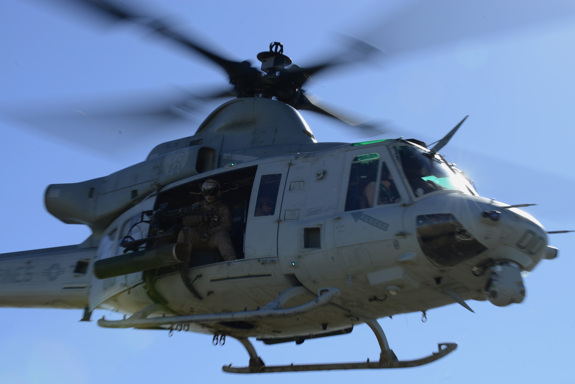 A U.S. Marine Corps UH-1Y Venom helicopter crew takes-off after picking up combat controllers at the Juniper Butte Bombing Range March 12, 2014, near Mountain Home Air Force Base, Idaho. Operations out of MHAFB will be increased throughout the week of March 10-14 due to the combat exercise Gunighter Flag. Gunfighter Flag is an excellent opportunity to prepare multiple joint and coalition terminal attack controller teams for upcoming deployments as well as provide proficiency training for air and ground crews. (U.S. Air Force photo by Senior Airman Benjamin Sutton/Released)