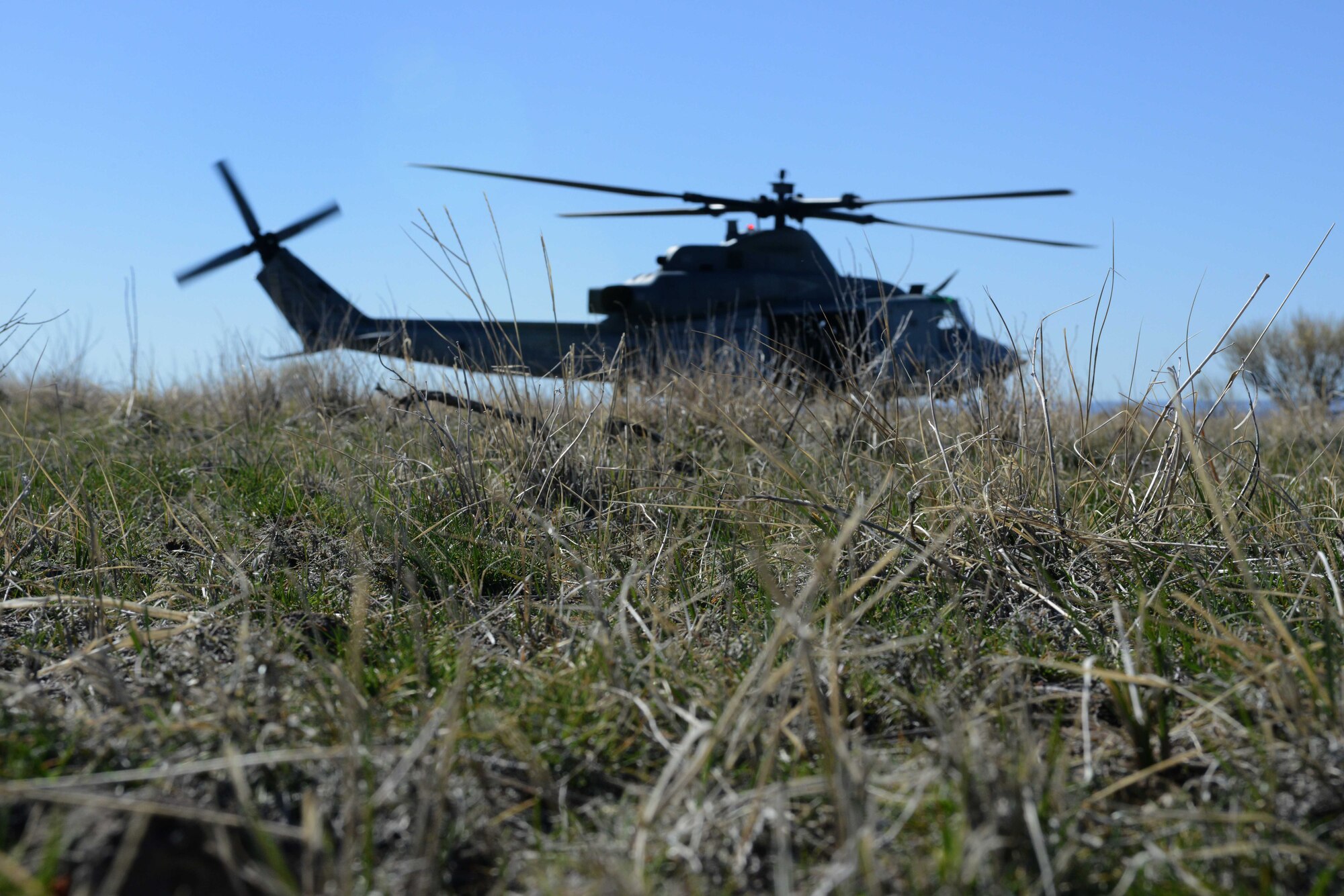 A UH-1Y Venom touches down and waits for an exfill of combat controllers during Gunfighter Flag, on the Juniper Butte Range at Mountain Home Air Force Base, Idaho, March 13, 2014. Members from the U.S Air Force, Marine Corps, Navy and the British Army will utilize the range complexes during the week-long exercise. (U.S. Air Force photo by Senior Airman Caitlin Guinazu/RELEASED)