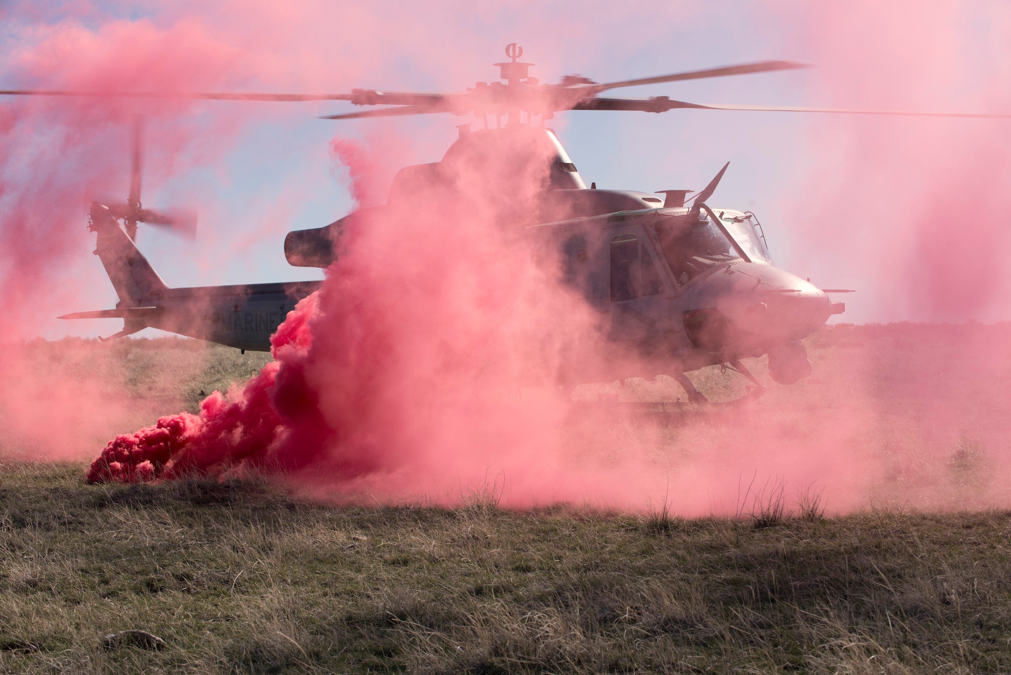 A UH-1Y Venom touches down before Air Force combat controllers exfill at Juniper Butte Range, Mountain Home Air Force Base, Idaho, March 12, 2014. Members from the U.S Air Force, Marine Corps, Navy and the British Army utilized the range complexes during the week-long Gunfighter Flag 14-2 exercise. (U.S. Air Force Photo by Airman 1st Class Malissa Lott/RELEASED)