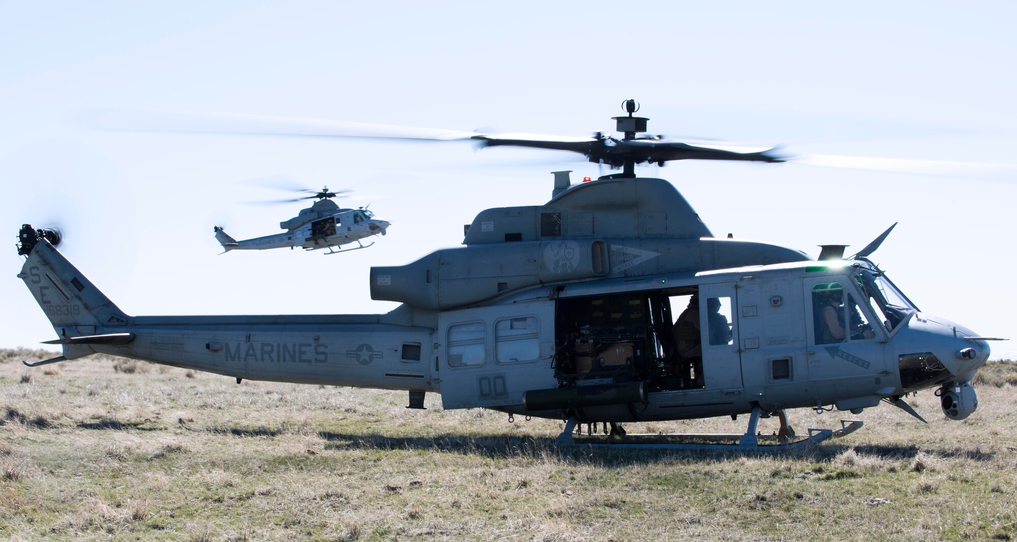 Two UH-1Y Venoms touched down at Juniper Butte Range, Mountain Home Air Force Base, Idaho, March 12, 2014. The Marine Corps works alongside the Air Force as a large-scale joint exercise. (U.S. Air Force Photo by Airman 1st Class Malissa Lott/RELEASED)