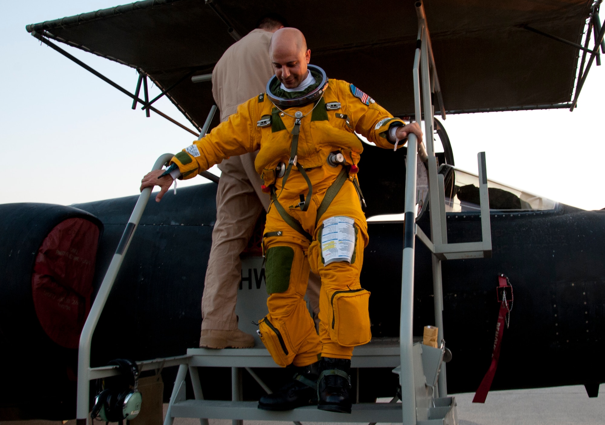 Air Force Maj. Ralph Shoukry, a pilot and tactics and employment lead assigned to the 99th Expeditionary Reconnaissance Squadron, steps off of a U-2 Dragonlady at an undisclosed location in Southwest Asia, March 6, 2014. Shoukry just passed more than 1,000 combat flying hours. (U.S. Air Force photo by Staff Sgt. Michael Means/Released)