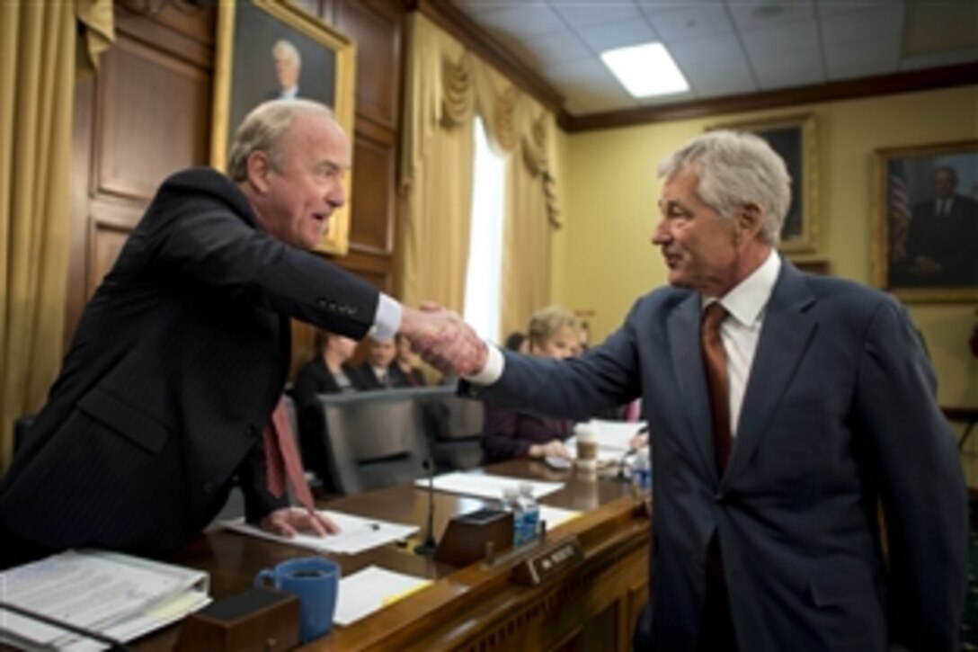 Defense Secretary Chuck Hagel greets U.S. Rep. Rodney Frelinghuysen of New Jersey, chairman of the House Appropriations Committee's defense subcommittee, before testifying on the Defense Department's fiscal year 2015 budget request before the subcommittee in Washington, D.C., March 13, 2014.