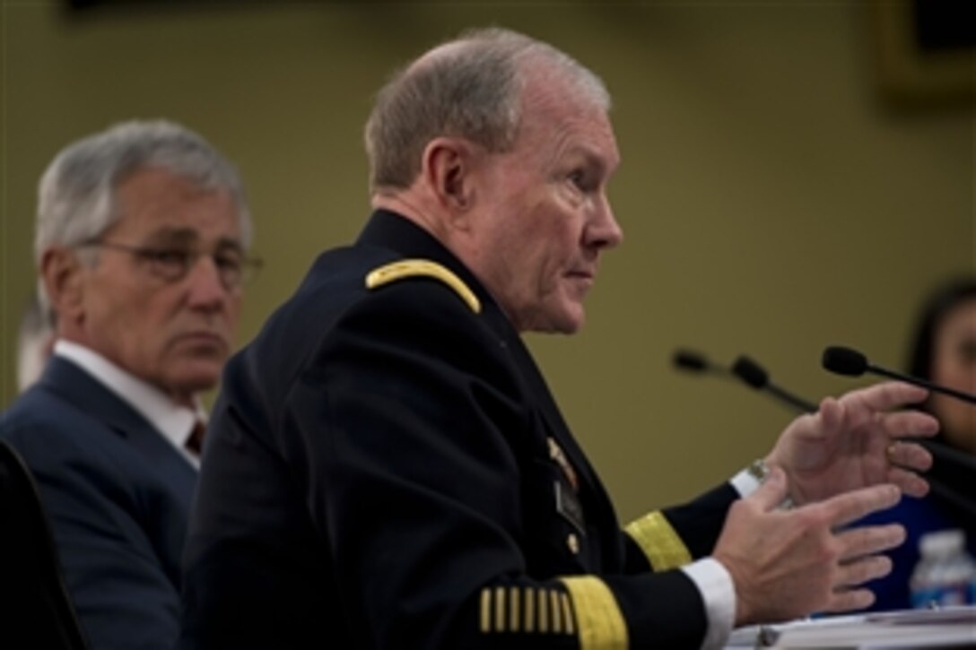 Army Gen. Martin E. Dempsey, chairman of the Joint Chiefs of Staff, testifies on the Defense Department's fiscal year 2015 budget request as Defense Secretary Chuck Hagel looks on before the House Appropriations Committee's defense subcommittee in Washington, D.C., March 13, 2014.