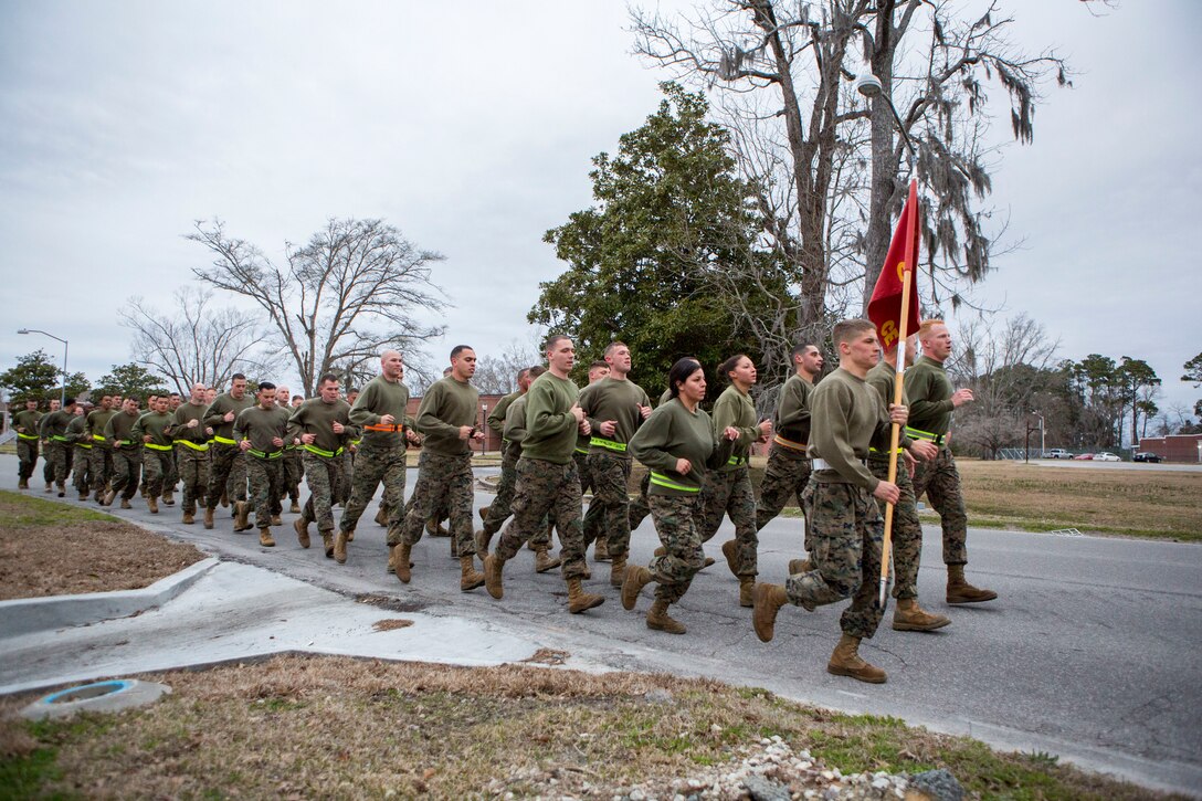 U.S. Marines assigned to 26th Marine Expeditionary Unit (MEU) Command Element (CE) conduct a formation run led by the unit’s non-commissioned officers (NCOs), aboard Camp Lejeune, N.C., Feb. 26, 2014. The physical training was conducted to foster unit cohesion and give NCOs the opportunity to coordinate and run a unit level event. (U.S. Marine Corps photo by Sgt. Christopher Q. Stone, 26th MEU Combat Camera/Released) 