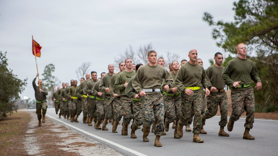 U.S. Marines assigned to 26th Marine Expeditionary Unit (MEU) Command Element (CE) conduct a formation run led by the unit’s non-commissioned officers (NCOs), aboard Camp Lejeune, N.C., Feb. 26, 2014. The physical training was conducted to foster unit cohesion and give NCOs the opportunity to coordinate and run a unit level event. (U.S. Marine Corps photo by Sgt. Christopher Q. Stone, 26th MEU Combat Camera/Released) 