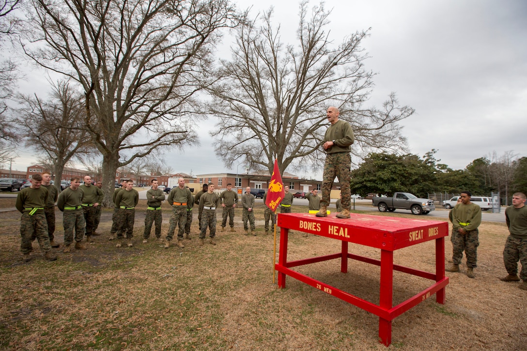 U.S. Marine Corps Col. Matthew G. St. Clair, 26th Marine Expeditionary Unit (MEU) commanding officer, speaks to Marines assigned to 26th MEU Command Element (CE)after a formation run led by the unit’s non-commissioned officers (NCOs), aboard Camp Lejeune, N.C., Feb. 26, 2014. The physical training was conducted to foster unit cohesion and give NCOs the opportunity to coordinate and run a unit level event. (U.S. Marine Corps photo by Sgt. Christopher Q. Stone, 26th MEU Combat Camera/Released) 