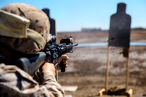 A Marine with Bridge Company, 8th Engineer Support Battalion, 2nd Marine Logistics Group fires an M-16A4 service rifle during the table three portion of the combat marksmanship program aboard Camp Lejeune, N.C., March 10, 2014. Marines with the company fired more than 7,000 rounds during day and night shoots. (U.S. Marine Corps photo by Lance Cpl. Shawn Valosin)