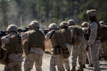 Staff Sgt. Scottie McDaniel, a Burlington, N.C., native and a combat marksmanship trainer with Bridge Company, 8th Engineer Support Battalion, 2nd Marine Logistics Group, supervises Marines during the table three and four portions of the combat marksmanship program aboard Camp Lejeune, N.C., March 10, 2014. McDaniel ensured that the ranges ran smoothly. (U.S. Marine Corps photo by Lance Cpl. Shawn Valosin)