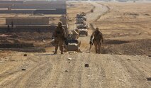 Marines sweep a road in Afghanistan using counter-improvised explosive device systems. These types of systems are under scrutiny by the Counter-IED War Room at Marine Corps Systems Command at Quantico, Va.