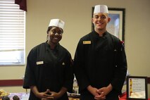 Sgt. Tannisha Gamble (left), a Jacksonville, Fla. native and Pfc. Jordan Agosto, a Brooklyn, N.Y. native both food service specialists with Food Service Company, Combat Logistics Regiment 27, 2nd Marine Logistics Group, pose for a picture at the chef of the quarter competition aboard Marine Corps Base Camp Lejeune, N.C., March 11, 2014. Gamble and Agosto won the competition, which was judged on cooking fundamentals, composition of dish, overall flavor, seasoning, doneness, timing of service and temperature. 