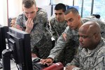 Soldiers from the Fairfax, Va.-based Data Processing Unit conduct a computer network defense exercise Sept. 15, 2012, in Fairfax. The exercise used different cyber scenarios of varying difficulty in order to evaluate the proficiency levels of the unit's Soldiers in computer network defense. (Photo by Cotton Puryear, Virginia National Guard/Released)