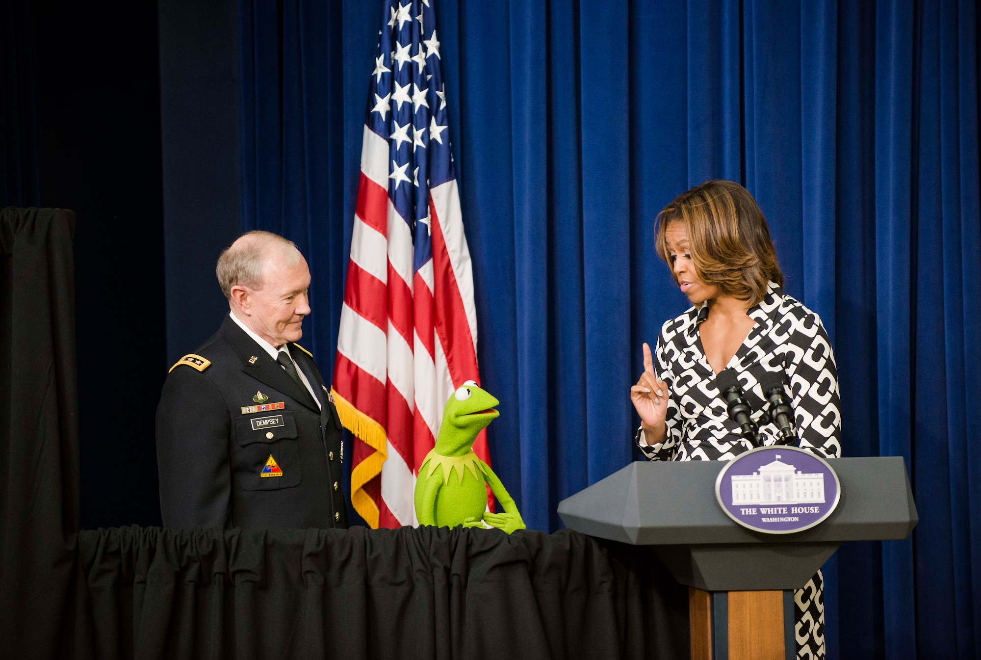 Army Gen. Martin E. Dempsey, the Chairman of the Joint Chiefs of Staff, joins First Lady Michelle Obama and Kermit the Frog in welcoming military families to a screening of the new movie "Muppets Most Wanted" March 12, 2014, at the White House. The trio thanked military families for their service, strength and resilience. (DOD photo/Army Staff Sgt. Sean K. Harp)   