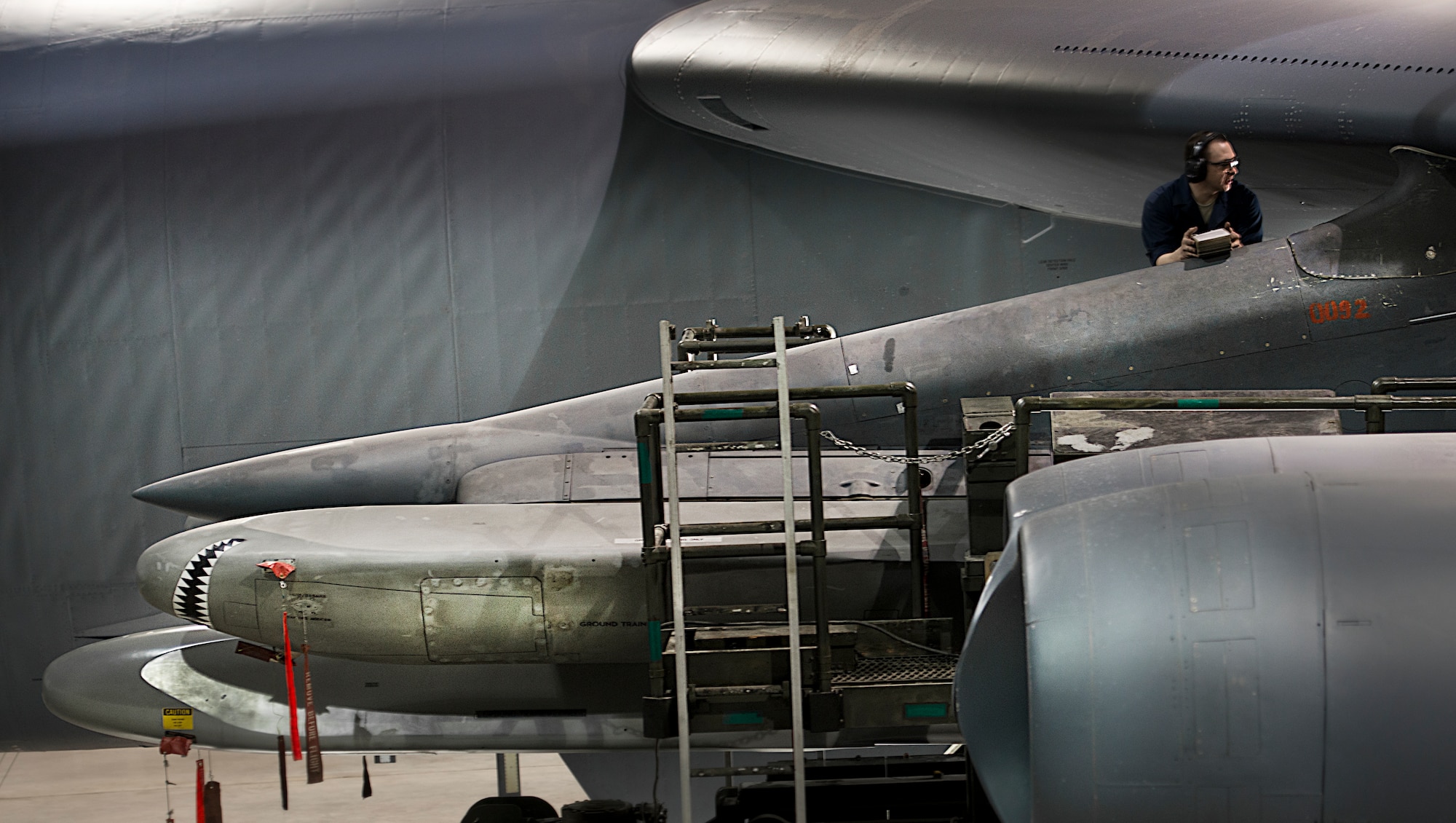 Staff Sgt. Jason Walters loads an AGM-86B air-cruise launch trainer missile onto a B-52H Stratofortess Feb. 26, 2014, at Minot Air Force Base, N.D. As part of Air Force Global Strike Command, load crews work endlessly to preserve our nation's security by providing combat-ready forces for nuclear deterrence and global strike operations. Walters is a 5th Aircraft Maintenance Squadron load crew member. (U.S. Air Force photo/Tech. Sgt. Aaron D. Allmon II)