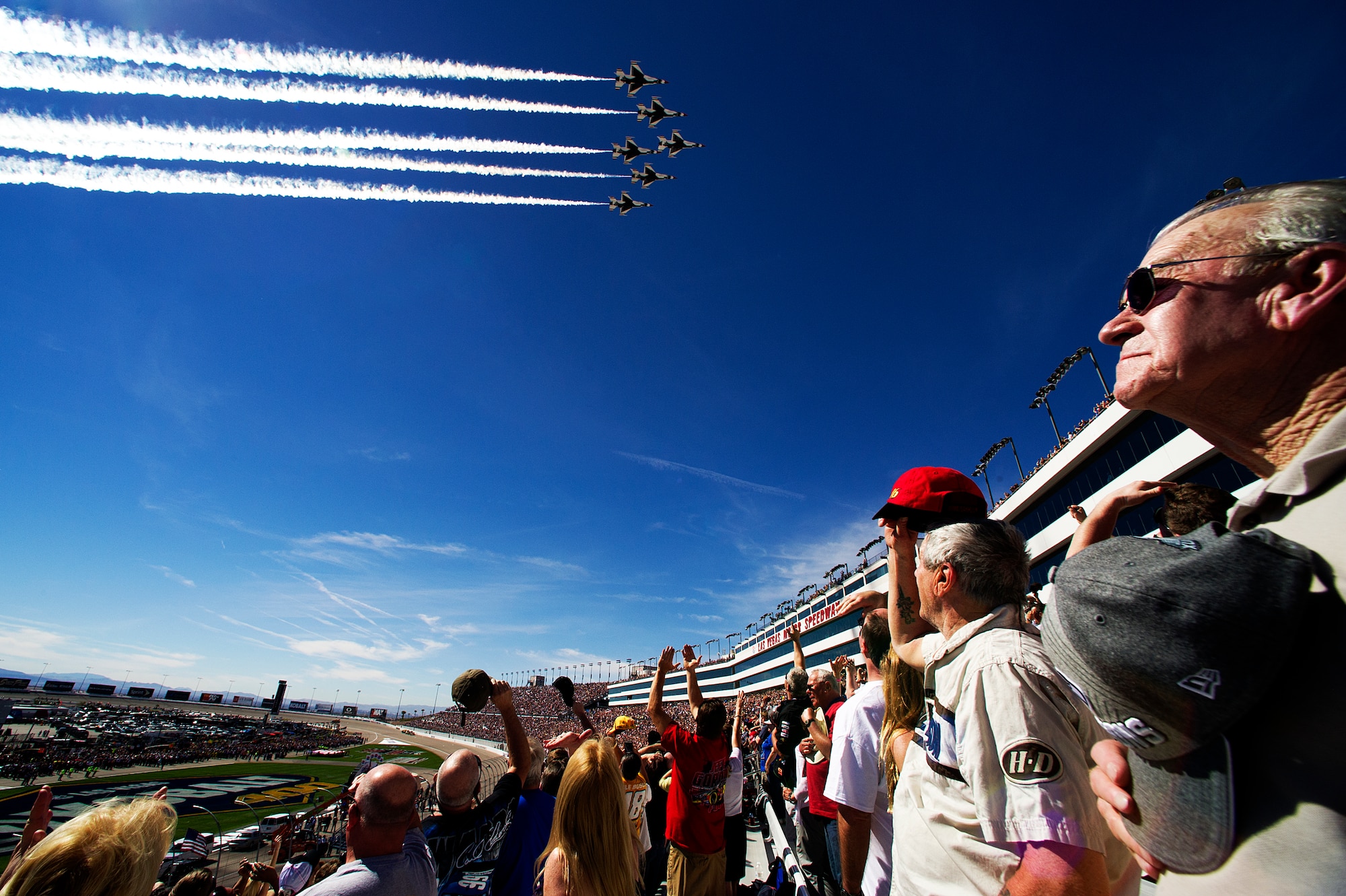 The Thunderbirds perform a fly-by March 9, 2014, over the Las Vegas Motor Speedway to start the NASCAR Kobalt Tools 400. The Thunderbirds are the Air Force Air Demonstration Squadron’s precision flying demonstration team that flies red, white and blue F-16 Fighting Falcons. (U.S. Air Force photo/Staff Sgt. Larry E. Reid Jr.)