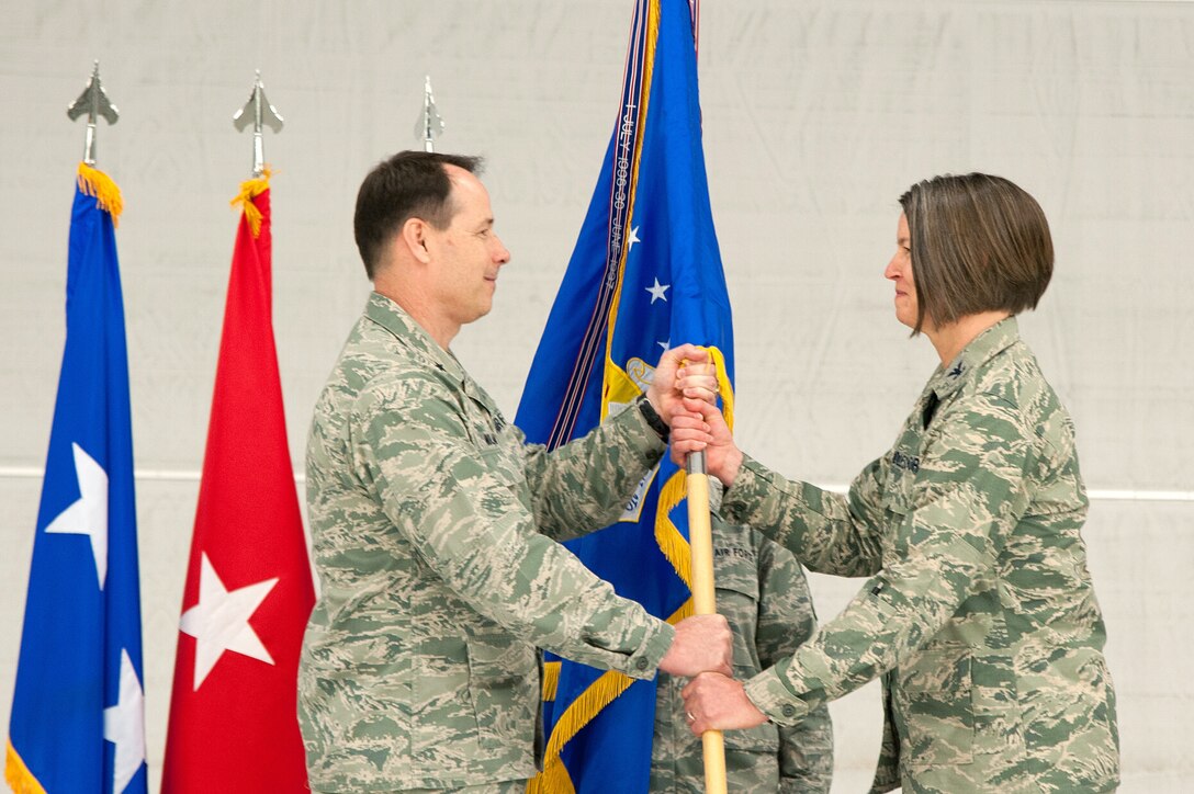 Col. Sherrie L. McCandless, the former director of plans and requirements for air at the National Guard Bureau, assumed command of the 124th Fighter Wing, Idaho Air National Guard from Col. Christopher D. Rood given by Brig. Gen. Michael Nolan, left, Assistant Adjutant General, Air, Commander Idaho Air National Guard, at Gowen Field, Boise, Idaho March 2. (Air National Guard photo by Master Sgt. Becky Vanshur)
