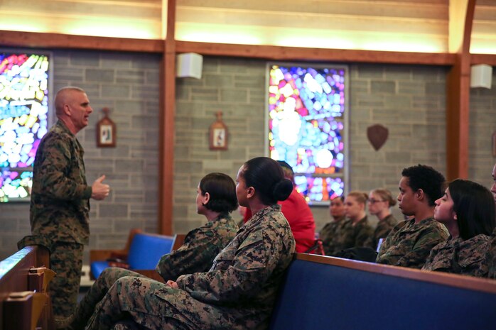 Sgt. Maj. Robert A. Allen Jr. gives the opening remarks at the third annual Vivian A. Holmes Female Marine Symposium, Feb. 25. (U.S. Marine Corps photo by Cpl. Mary M. Carmona/Released.)