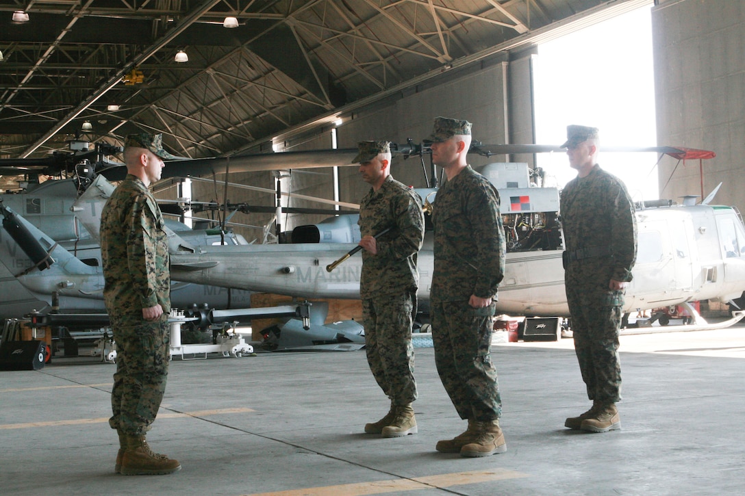 Sgt. Maj. Wayne L. Allen posts for relief by Sgt. Maj. Charles E. Wells as the new sergeant major of Marine Light Attack Helicopter Squadron (HMLA) 167 during a relief and appointment ceremony held in the squadron's hangar aboard Marine Corps Air Station New River, N.C., Feb. 27, 2014.