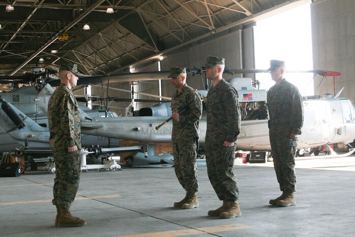 Sgt. Maj. Wayne L. Allen posts for relief by Sgt. Maj. Charles E. Wells as the new sergeant major of Marine Light Attack Helicopter Squadron (HMLA) 167 during a relief and appointment ceremony held in the squadron's hangar aboard Marine Corps Air Station New River, N.C., Feb. 27, 2014.