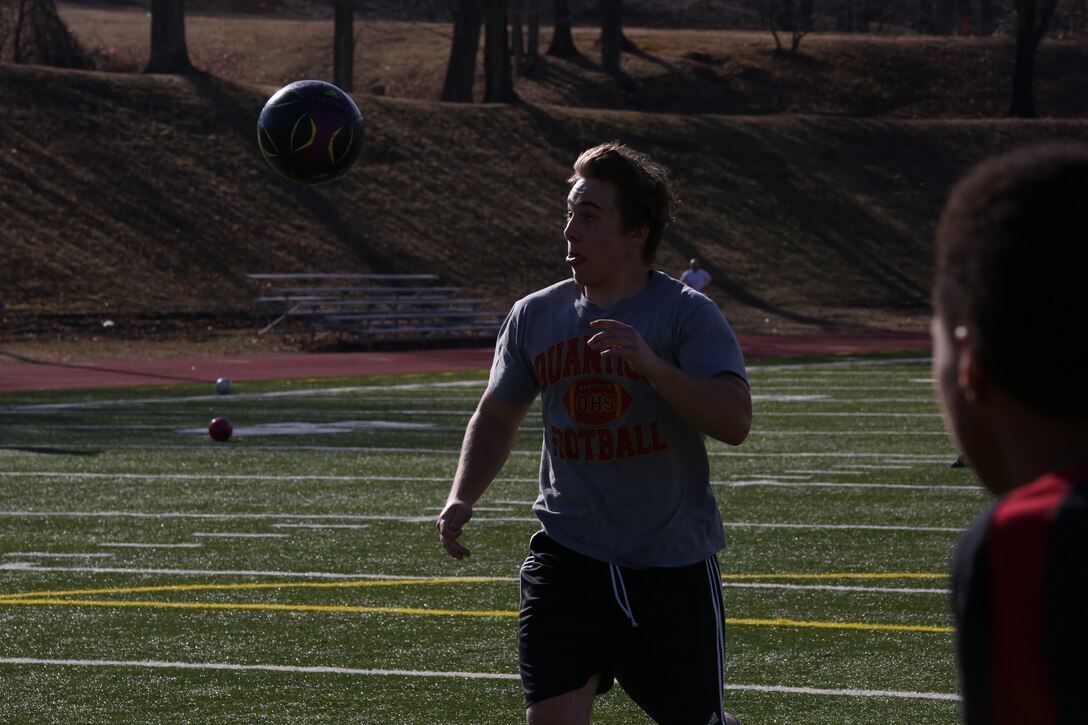 Howard, a senior and three-year veteran and co-captain of the Quantico Middle/High School boys soccer team, practices passing drills during practice on March 11, 2014, at Butler Stadium. Howard and the small group of veteran players are working to help the rookies with their skills and hope to inspire a love for the game. 