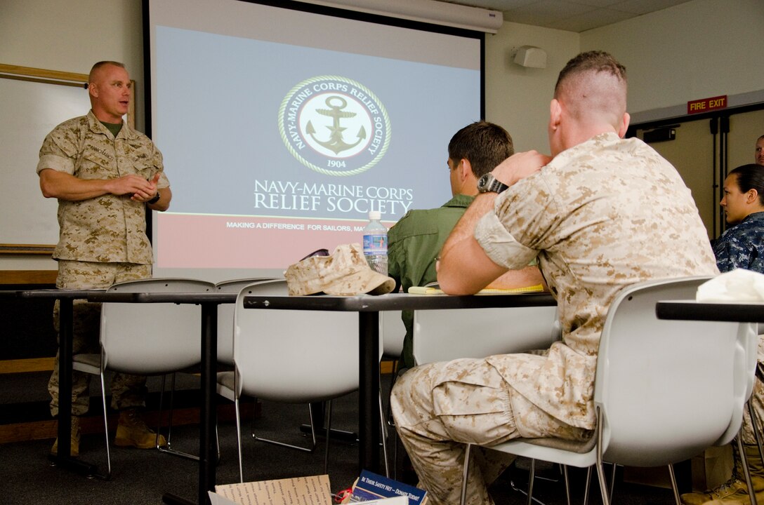 Col. Brian P. Annichiarico, commanding officer Marine Corps Base Hawaii, speaks to unit representatives at the kick-off brief for the Navy-Marine Corps Relief Society Active Duty Fund Drive in classroom 2 of Combat Camera, March 13, 2014. Annichiarico filled out an allotment form, donating to the society after his remarks. (U.S. Marine Corps photo by Kristen Wong)