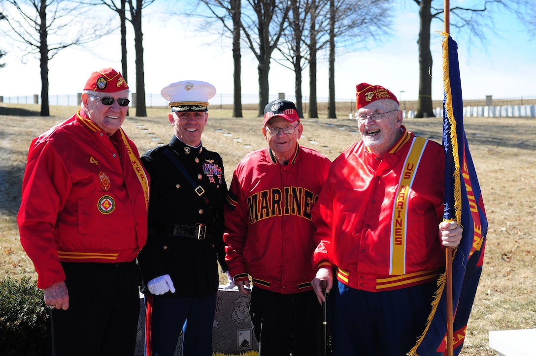 Three Marines who fought at Iwo Jima stand with Lt. Col. Mitchell Hoines March 14 following the ceremony to celebrate the 69th anniversary of the flag raising on Mt. Suribachi. Hoines is the deputy director of the Marine detachment in Leavenworth, KS., and the three Marines are part of the Marine Corps league in Leavenworth. 