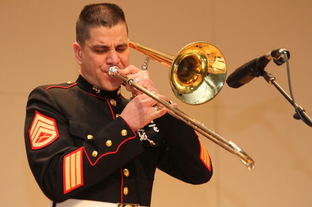DANBURY, Conn. - Staff Sgt. Ken Ebo, an instructor at the Naval School of Music in Virginia Beach, Va., and trombone player for the Marine Corps Jazz Ensemble, performs with the Marine Corps Jazz Ensemble on March 4 at Western Connecticut State University.  Ebo, from Aiken, S.C., along with five other Marine musicians in a Marine Corps Jazz Ensemble are touring the 1st Marine Corps District’s area of operations to spread knowledge of the Marine Corps’ Musician Enlistment Option Program.  (U.S. Marine Corps photo by Lance Cpl. Brandon Thomas).