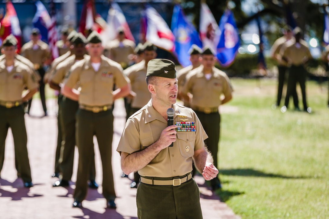 Col. Scott F. Benedict, commanding officer of the 24th Marine Expeditionary Unit, speaks during the relief and appointment ceremony for the command sergeant major in front of the II Marine Expeditionary Force headquarters aboard Marine Corps Base Camp Lejeune, N.C., March 14. Benedict thanked Sgt. Maj. Octaviano Gallegos Jr. for his service and dedication, and he welcomed Sgt. Maj. Lanette N. Wright, the first female sergeant major to lead a MEU, to the unit.